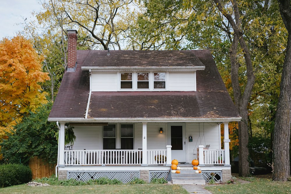 Lived-in neighborhood house with a front porch