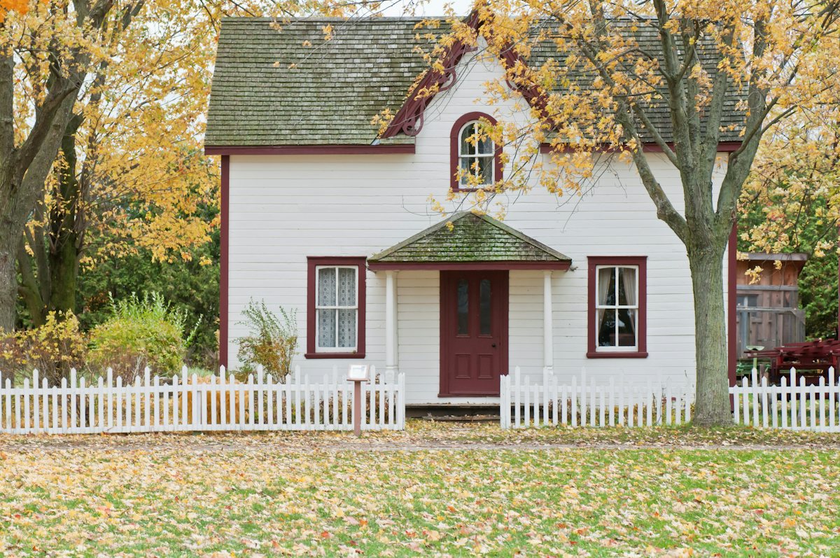 Lived-in neighborhood cottage with a front garden and porch